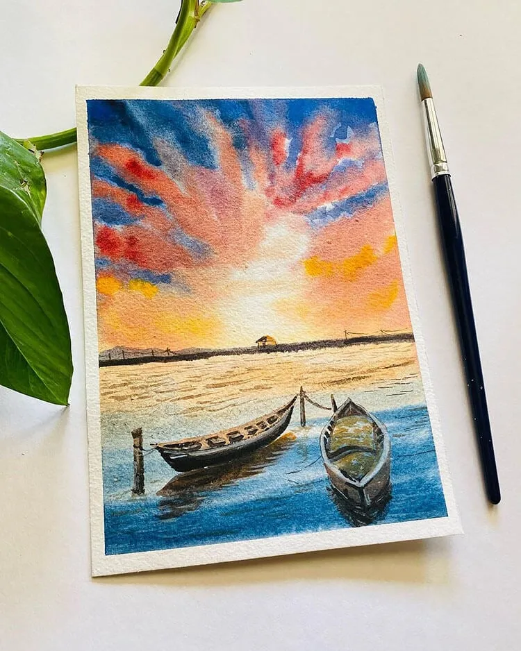puesta de sol con barcos